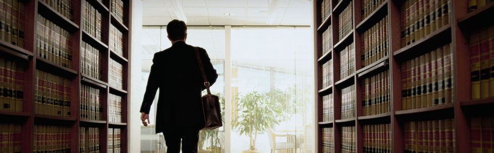 Lawyer from Lawrence MA walking through a library